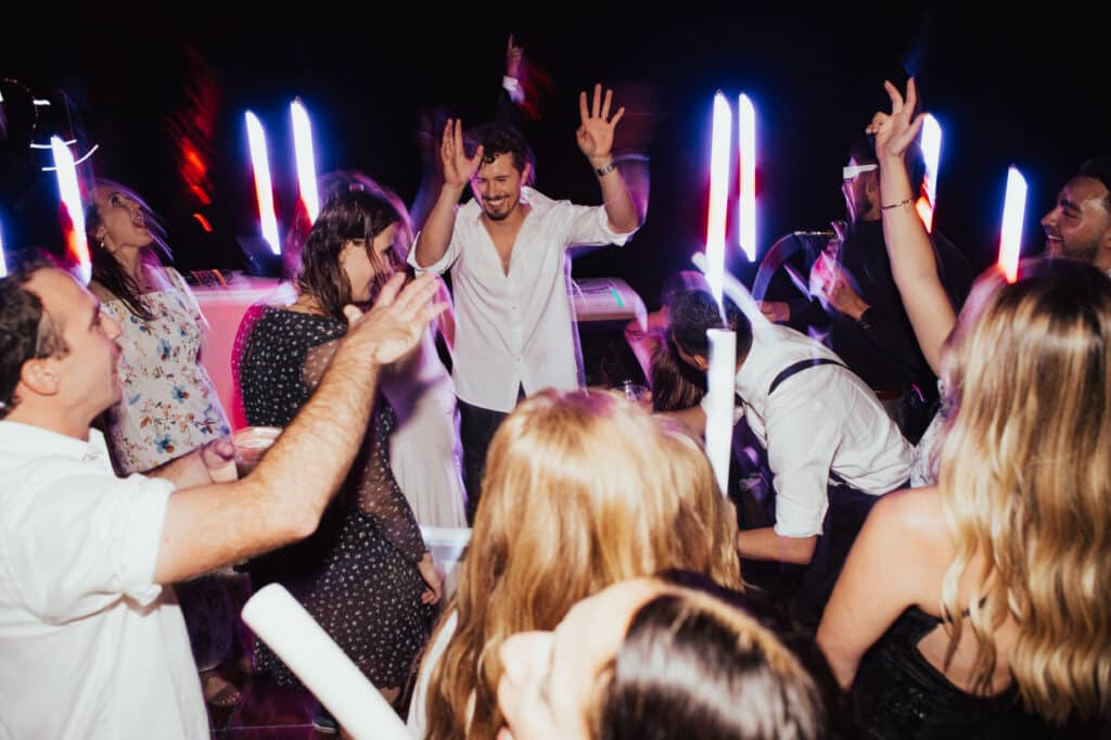Alexia & Isaiah's EDM Wedding Groom front and center of the dance floor.