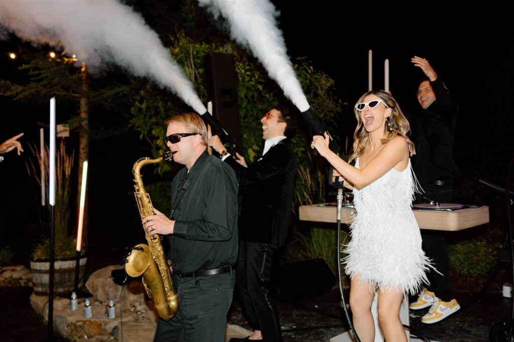 Sax player with Bride and Groom energizing the crowd. 