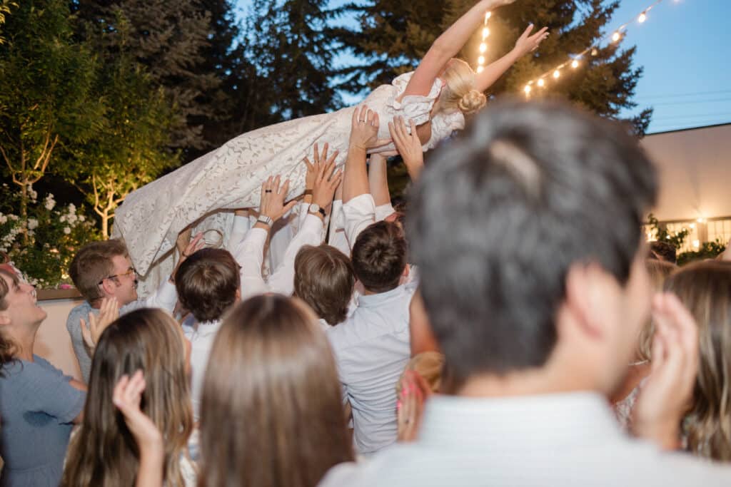 Wedding Reception at Twenty and Creek Bride Crowd Surfing